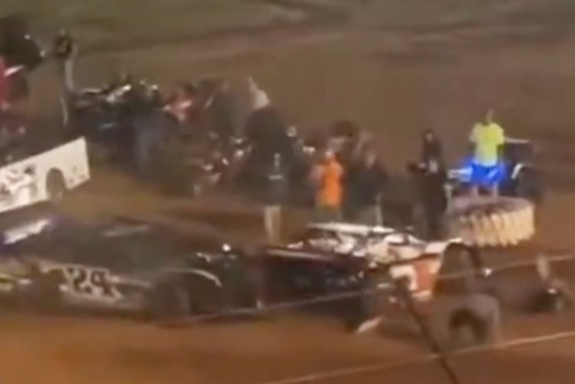 Driver arrested and banned after ramming car in the pits, knocking over crew members Driver arrested and banned after ramming car in the pits, knocking over crew members